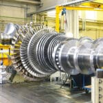 assembling and constructing gas turbines in a modern industrial factory